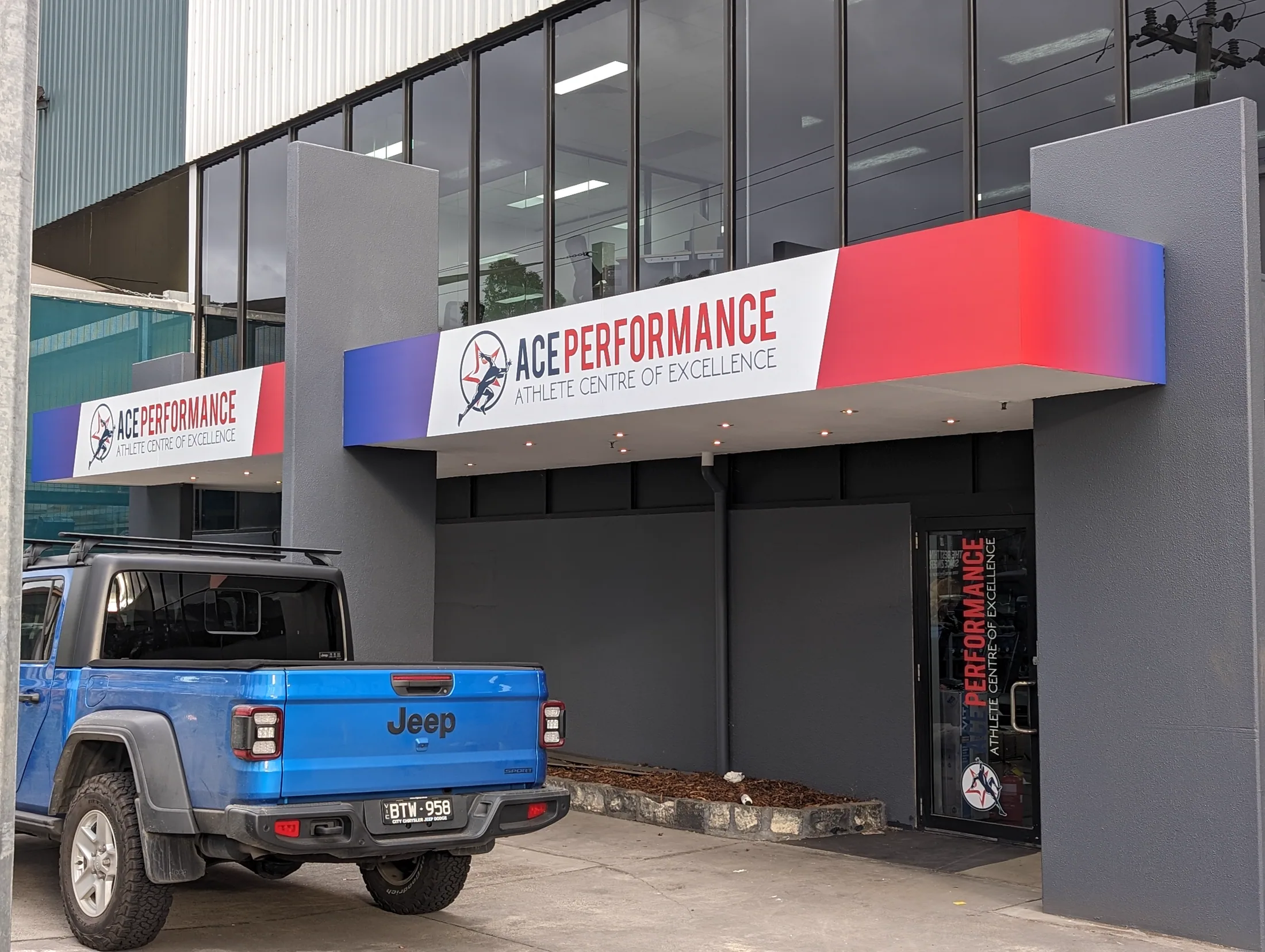 ACE Performance signage on the completed facade