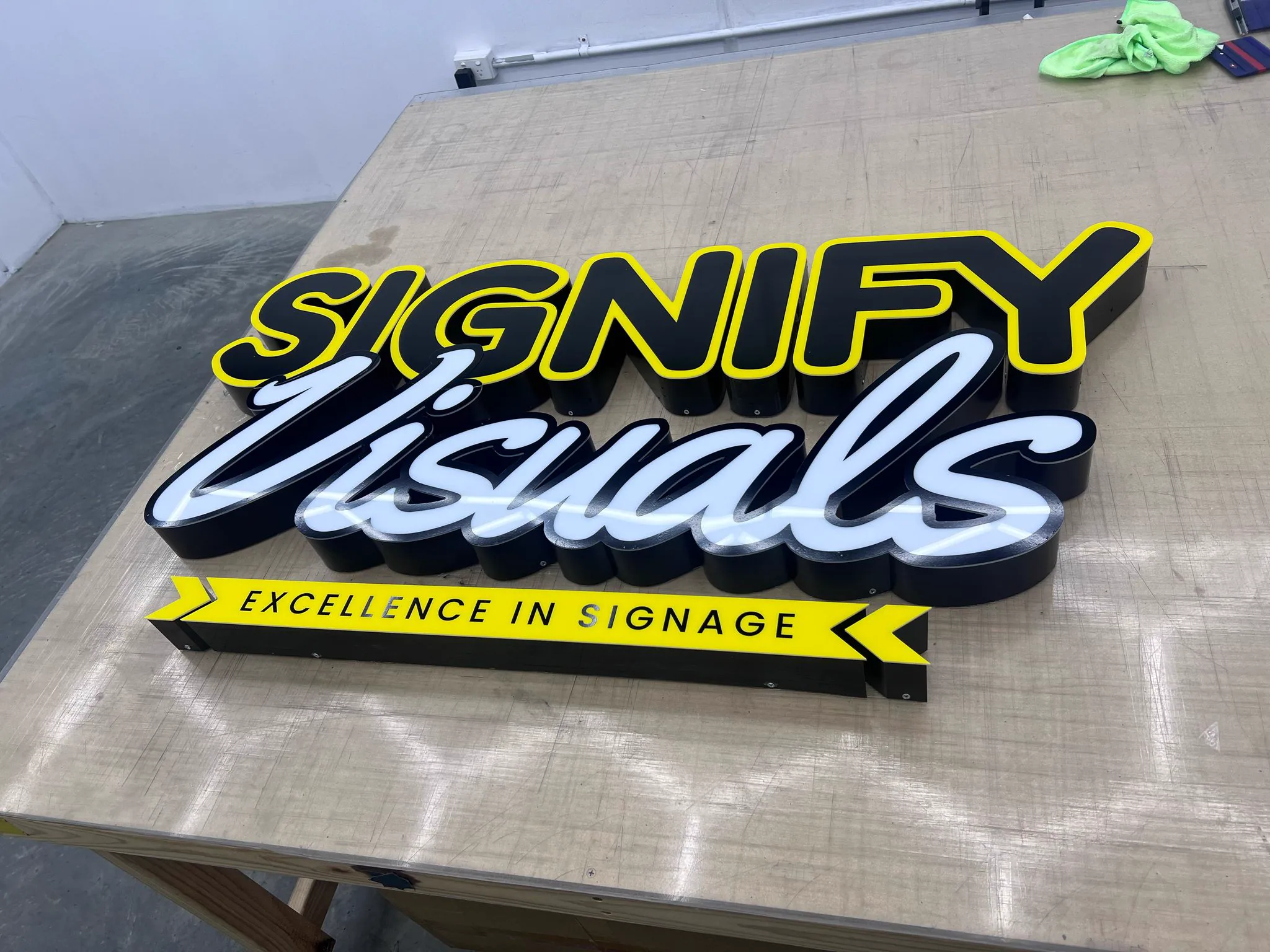 Signify Visuals workshop sign and branded ute