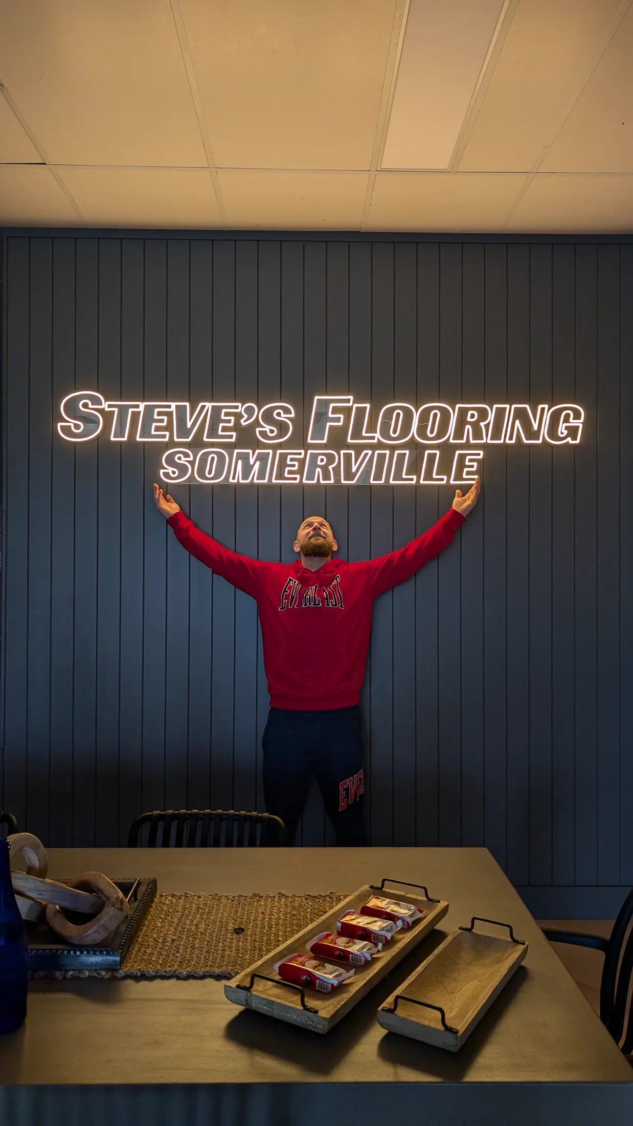 Illuminated Steve's Flooring Somerville lettering inside the showroom
