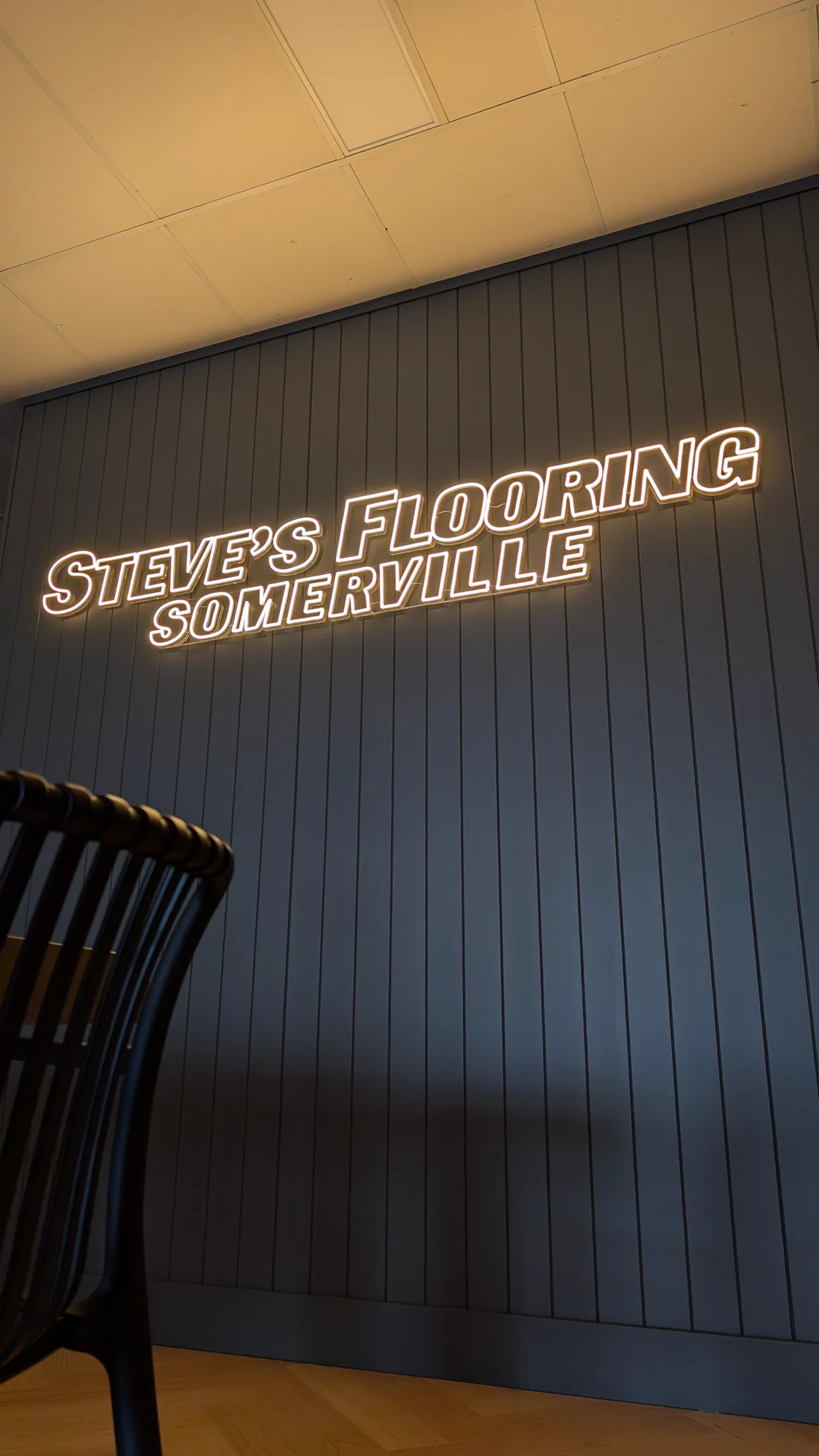 Steve's Flooring illuminated wall lettering