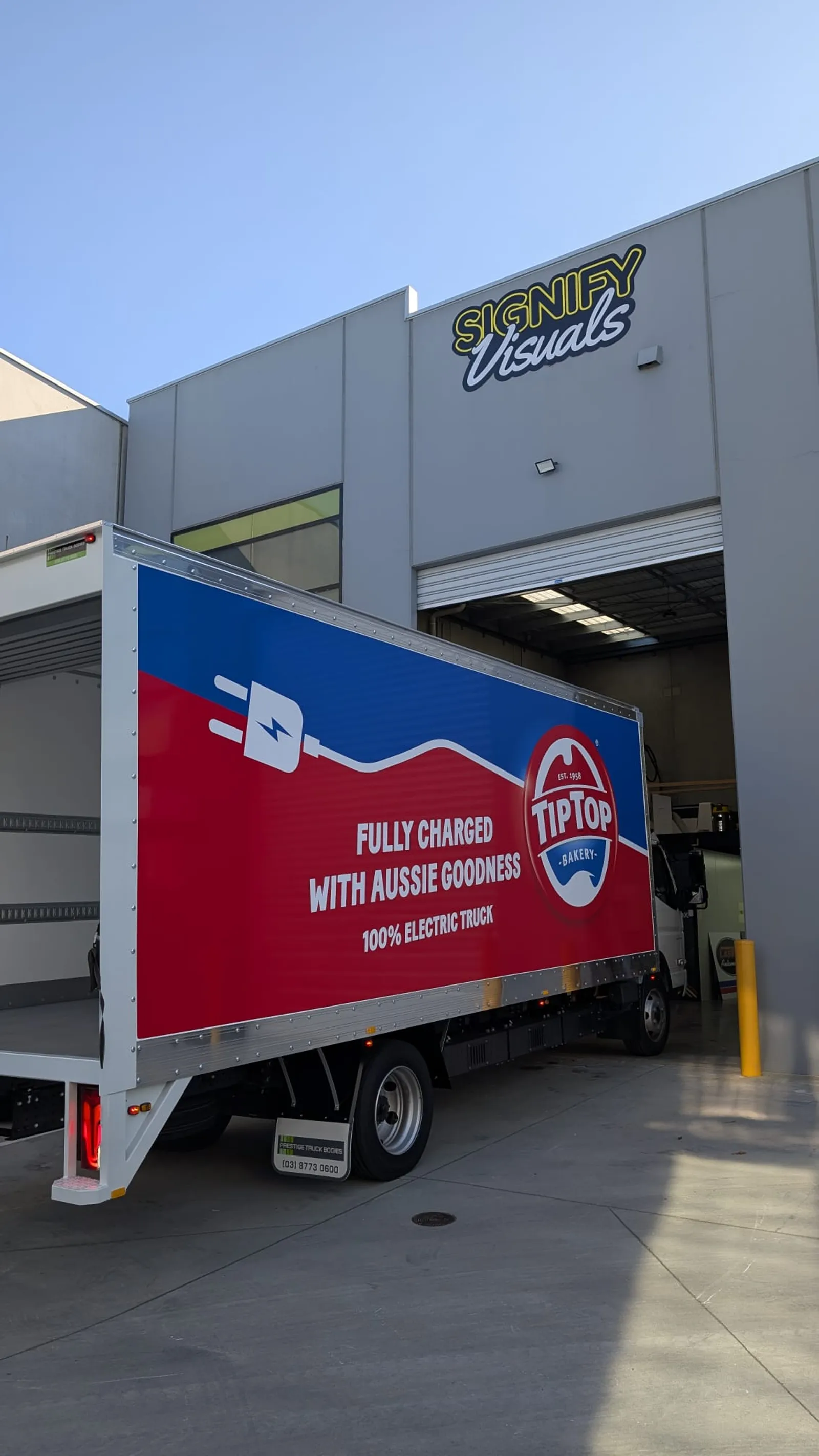 Tip Top Bakery branded electric truck signage